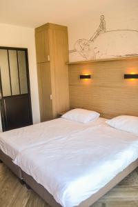 Letto o letti in una camera di Hotel Sandeshoved Zeedijk