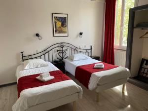 Postel nebo postele na pokoji v ubytování Hostellerie De La Source