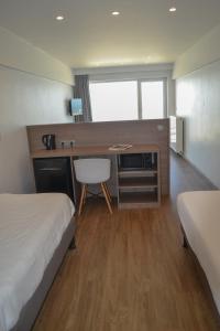 Letto o letti in una camera di Hotel Sandeshoved Zeedijk