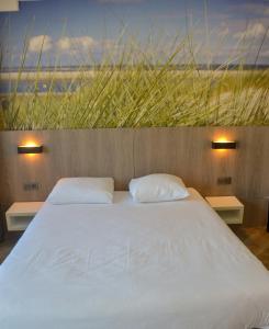 Letto o letti in una camera di Hotel Sandeshoved Zeedijk