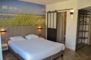Letto o letti in una camera di Hotel Sandeshoved Zeedijk