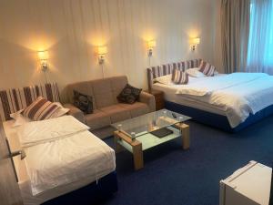 Postel nebo postele na pokoji v ubytování Hotel Austria