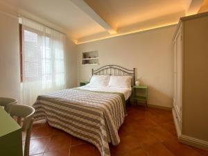 A bed or beds in a room at B&B San Francesco