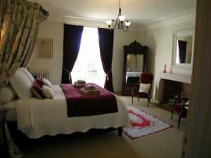 a bedroom with a bed with teddy bears on it at Château du Bourbet in Cherval