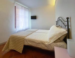 A bed or beds in a room at B&B San Francesco