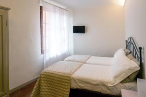 A bed or beds in a room at B&B San Francesco