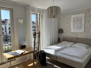 Posteľ alebo postele v izbe v ubytovaní Apartament Przy Plaży BOHO Świnoujście
