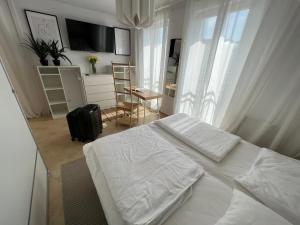 Posteľ alebo postele v izbe v ubytovaní Apartament Przy Plaży BOHO Świnoujście