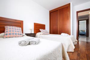 Posteľ alebo postele v izbe v ubytovaní FTV Holidays Homes