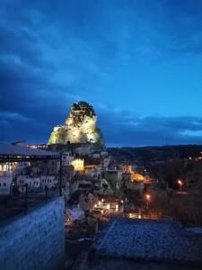 a view of a mountain at night at patisca cave house in cappadocia in Urgup