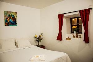 Postel nebo postele na pokoji v ubytování Posada Catama INN