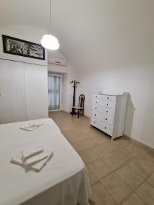 Postel nebo postele na pokoji v ubytování Aria di Sale Polignano