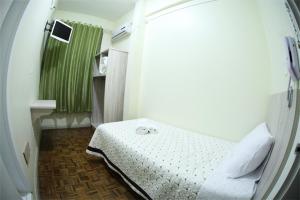 Uma cama ou camas num quarto em Hotel Condá