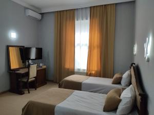 Postel nebo postele na pokoji v ubytování Shindan Hotel Astara