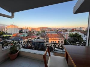 a balcony with a view of a city at Shkodra Duplex Apartment in Shkodër