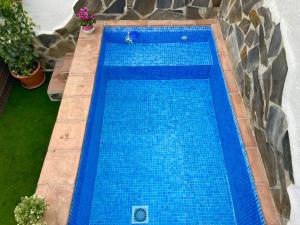 an overhead view of a blue swimming pool at Casa La Parra, 64 in Nerja