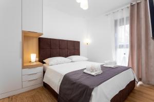 Postel nebo postele na pokoji v ubytování Villa Mare's 2