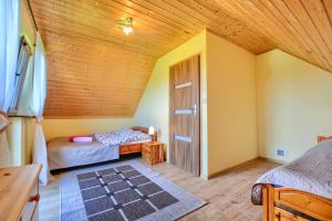 Posteľ alebo postele v izbe v ubytovaní Domek u Mirosi