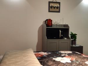 Televízia a/alebo spoločenská miestnosť v ubytovaní Apartments Benic