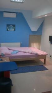 Postel nebo postele na pokoji v ubytování Hostel Paparazzo & Apartmens