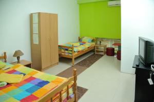 Postel nebo postele na pokoji v ubytování Hostel Paparazzo & Apartmens