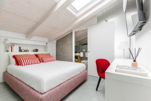 A bed or beds in a room at Manganelli Suite
