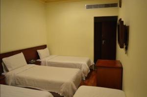 Giường trong phòng chung tại MIRA AL SHEAB