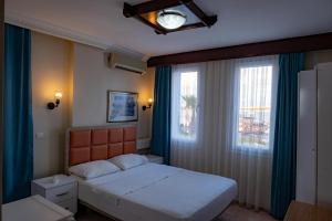 Postel nebo postele na pokoji v ubytování Arden Hotel