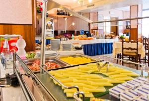 a buffet line with many different types of food at Appartamenti Bianchi in Bibione
