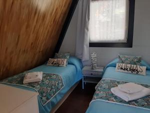 Säng eller sängar i ett rum på La Dorita cabaña de montaña