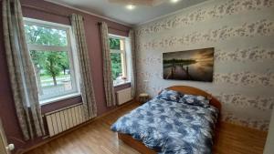 מיטה או מיטות בחדר ב-Daugavpils city centre