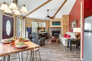 a living room with a table and a couch at Gnoming Around in Gatlinburg