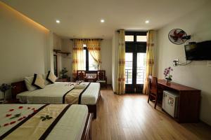 Кровать или кровати в номере The Sun Homestay