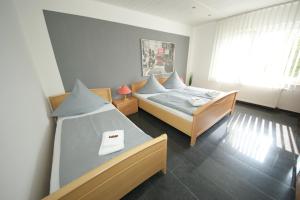 Postel nebo postele na pokoji v ubytování Hotel am Rosenplatz,24 Stunden Check in, kostenfreie Parkplätze