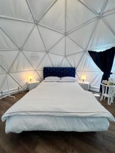 a bedroom with a bed in a yurt at Bertam Cottage Penang in Kepala Batas
