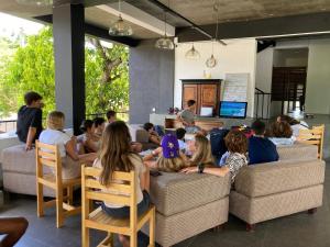 a group of people sitting on couches in a room at Handagedara Resort & Spa in Mirissa