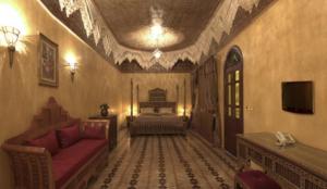 a living room with a couch and a bed at Mumtaz Mahal in Essaouira