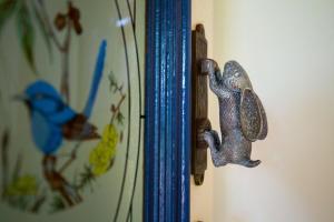 a close up of two books with birds on them at Cloud 9 Eagle Heights - Cliff-Top, Ocean Sunrise, VIP Retreat in Mount Tamborine