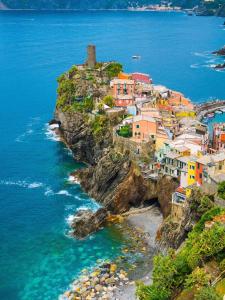 a village on a cliff near the ocean at Ca del Mare - FREE Parking in La Spezia