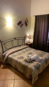 Ein Bett oder Betten in einem Zimmer der Unterkunft Agriturismo La Palazzina