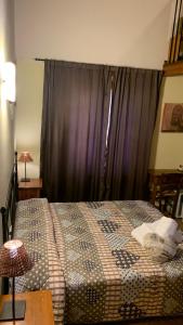 Ein Bett oder Betten in einem Zimmer der Unterkunft Agriturismo La Palazzina