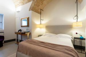 Letto o letti in una camera di Palazzo De Noha - Boutique Hotel