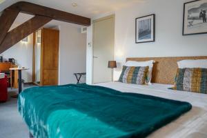 Кровать или кровати в номере Hotel de Flandre Ghent
