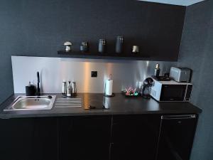 Kuchyň nebo kuchyňský kout v ubytování AVEC TOI suite spa