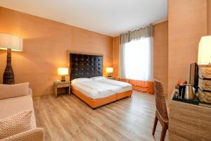 Voodi või voodid majutusasutuse Hotel Flaminia toas