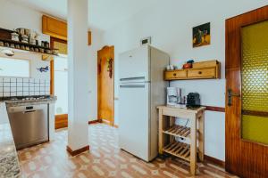 Кухня или мини-кухня в Cuore di Ognina - Appartamenti vista mare
