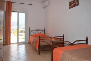 Postel nebo postele na pokoji v ubytování Bali House