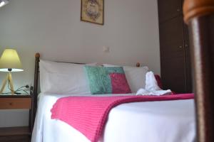 Postel nebo postele na pokoji v ubytování Bali House