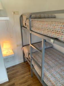 A bed or beds in a room at Mas Pinell 3 -Viu bé