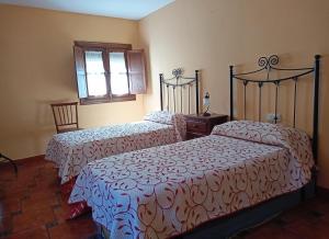 Posteľ alebo postele v izbe v ubytovaní Casa Cofrades